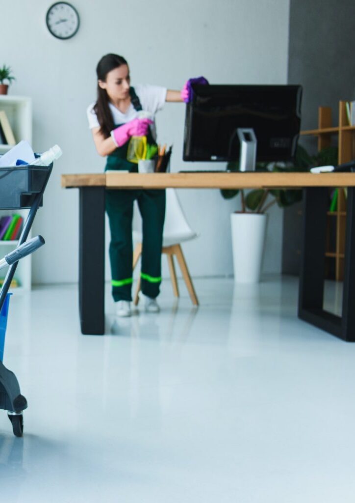 young female janitor cleaning office with various cleaning equipment 1536x1025 1 e1710282762997